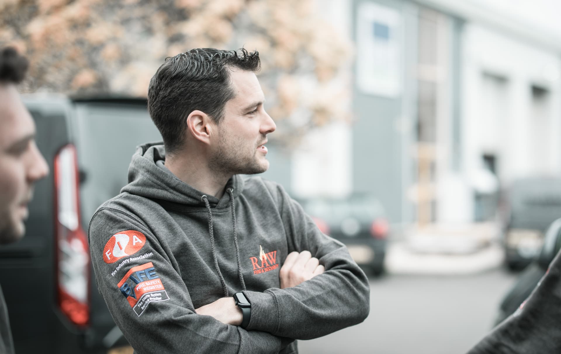 RAW engineer wearing a BAFE and FIA badged hoodie on site